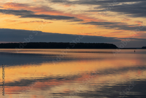 Fototapeta Naklejka Na Ścianę i Meble -  Golden sunset over Lake Seksty. Landscape of Masuria in Poland, Karwik village in the Pisz area.