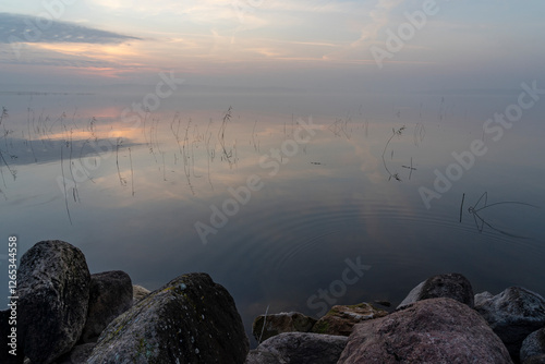 Fototapeta Naklejka Na Ścianę i Meble -  Foggy golden sunset over Lake Seksty. Landscape of Masuria in Poland, Karwik village in the Pisz area.