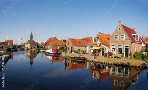 Zijlroede canal with houses and Sylhus, lock house, in old town of Hindeloopen, Friesland, Netherlands photo