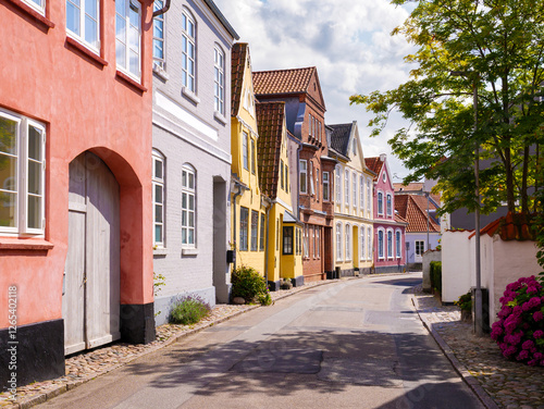 Streetscape with pastel-colored townhouses in Sønderborg old town, Als Island, Denmark photo