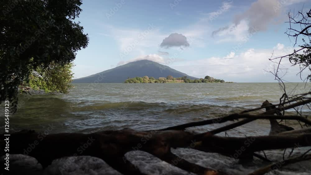 Maderas Volcano rises majestically over Ometepe Island as seen from Charco Verde Reserve, showcasing the stunning natural beauty of Nicaragua in Central America.