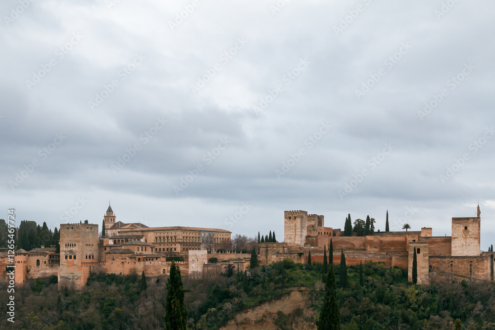 View of the Alhambra palace on a cloudy day from Mirador de San Nicolas View of the Alhambra palace on a cloudy day from Mirador de San Nicolas