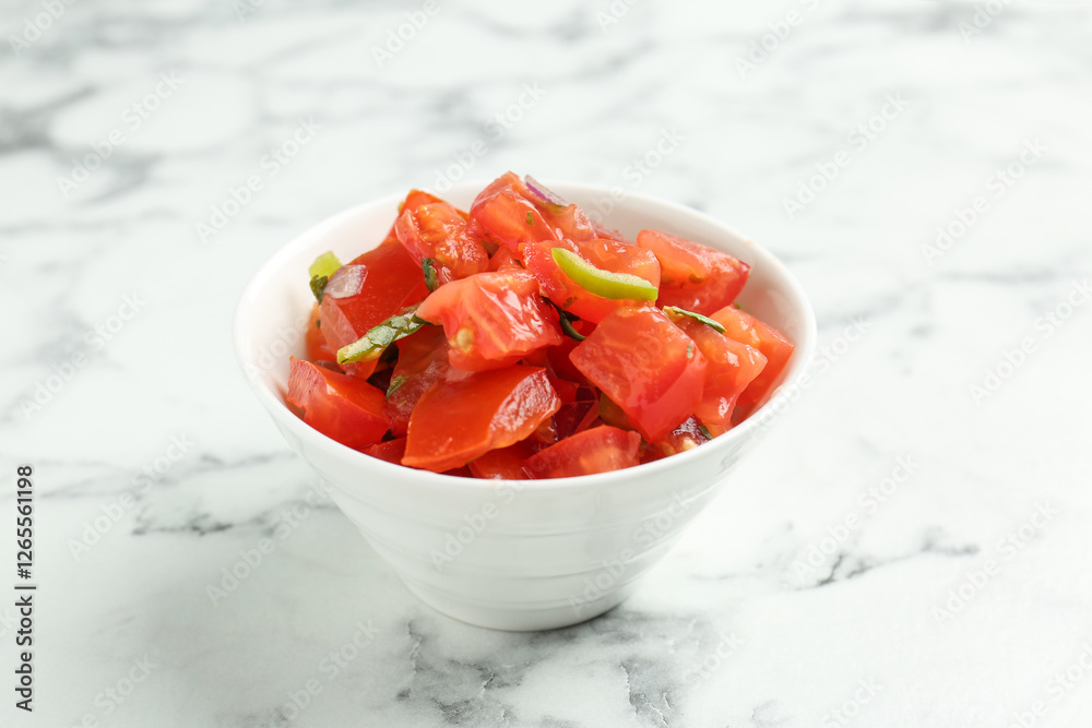 Delicious salsa on white marble table, closeup Delicious salsa on white marble table, closeup