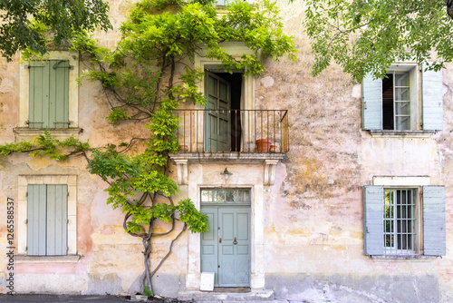 Rustic French House with Shuttered Windows and Climbing Vine
