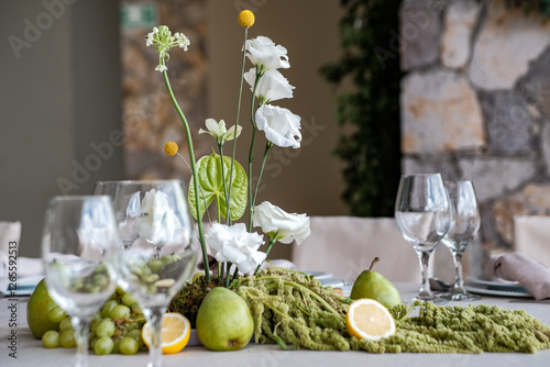 elegant wedding tablescape with white flowers and real fruit