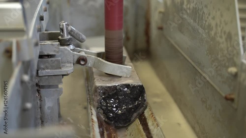 The machine drills core samples for study in the laboratory