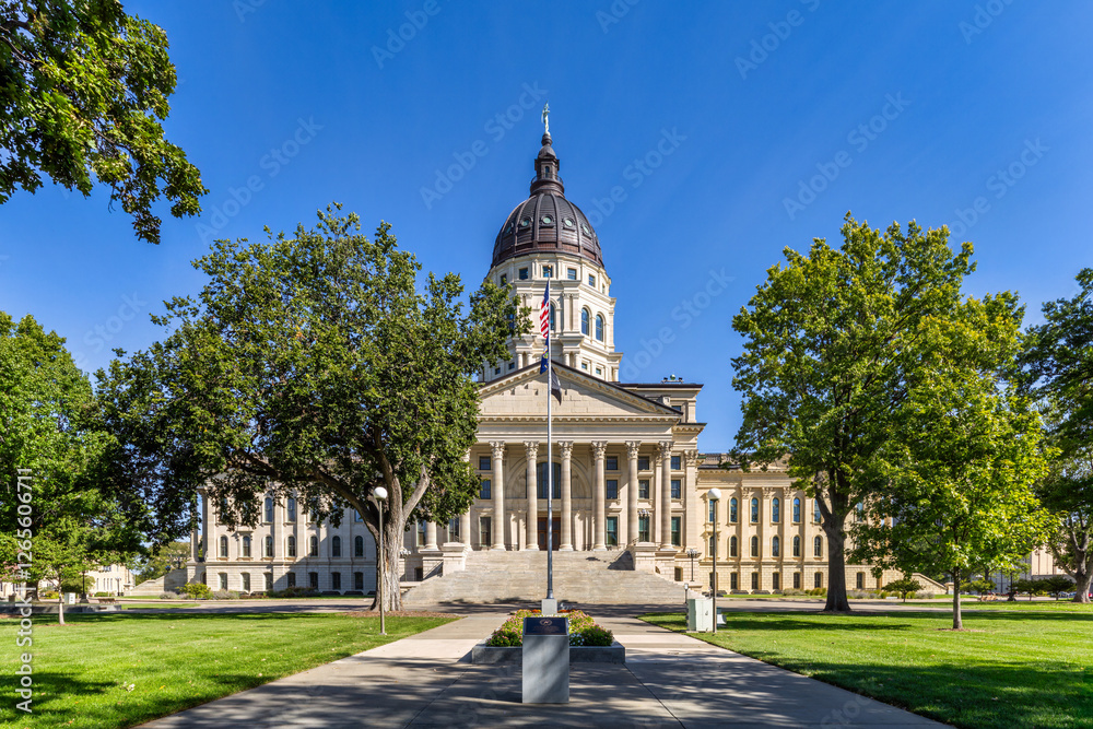 Kansas State Capitol, in Topeka on a sunny day. The Kansas State Capitol is the building housing the executive and legislative branches of government for the U.S. state of Kansas