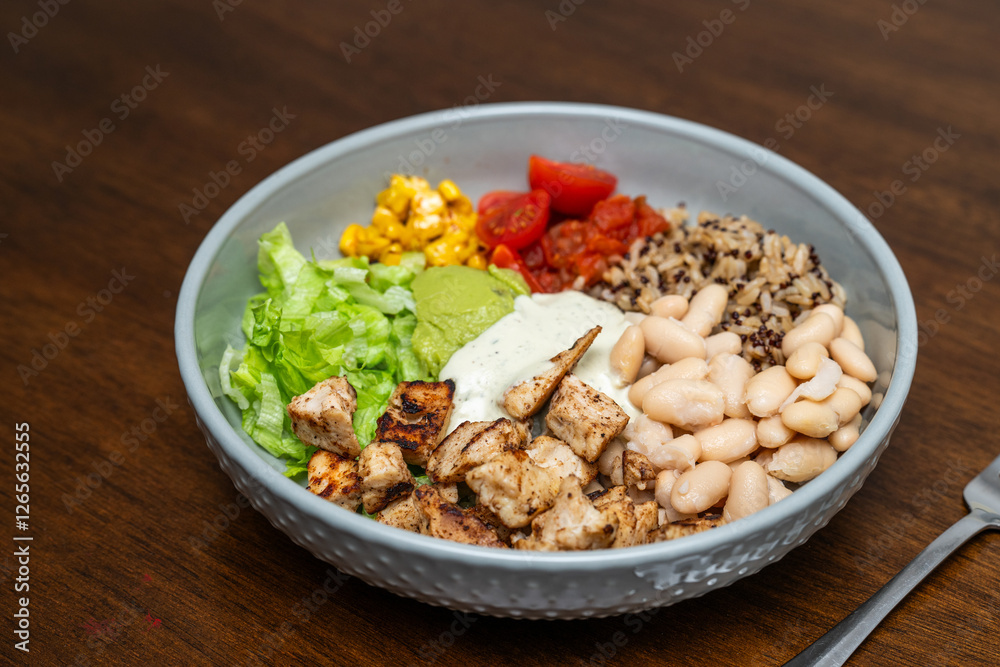 Fiesta bowl, Mexican food dish bowl with chicken, rice, corn and vegetables. Taco or burrito bowl. Fiesta bowl, Mexican food dish bowl with chicken, rice, corn and vegetables. Taco or burrito bowl.