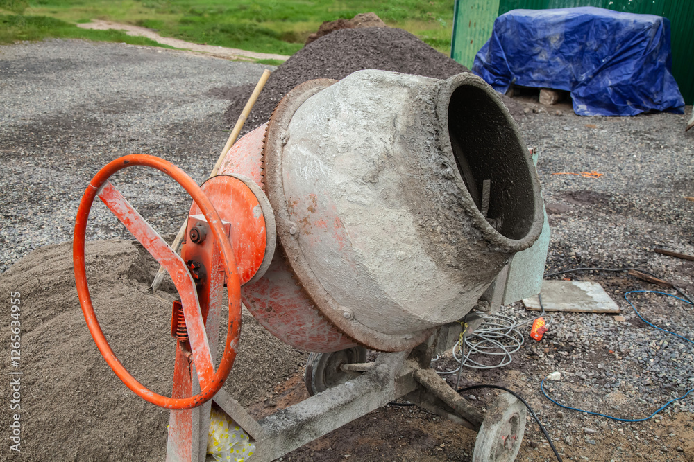A concrete mixer for preparing concrete at a construction site A concrete mixer for preparing concrete at a construction site