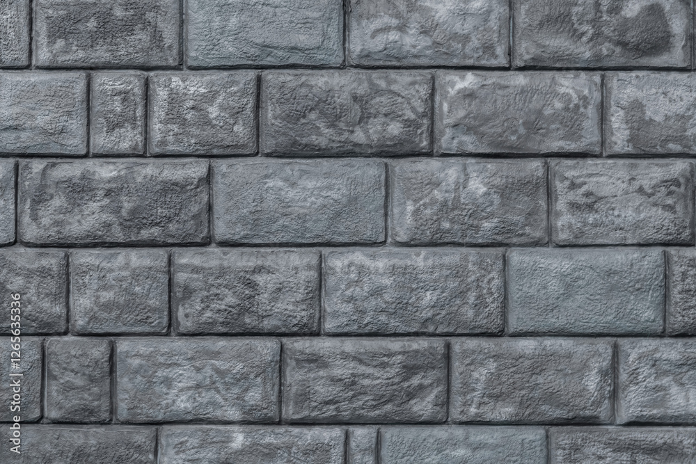 Fototapeta premium Gray brick wall with a gray brick