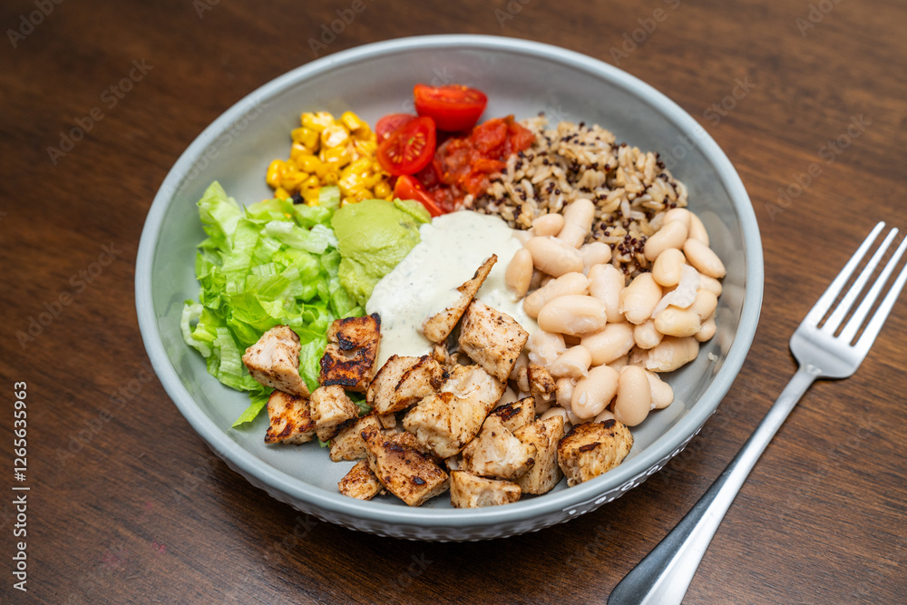 Fiesta bowl, Mexican food dish bowl with chicken, rice, corn and vegetables. Taco or burrito bowl. Fiesta bowl, Mexican food dish bowl with chicken, rice, corn and vegetables. Taco or burrito bowl.