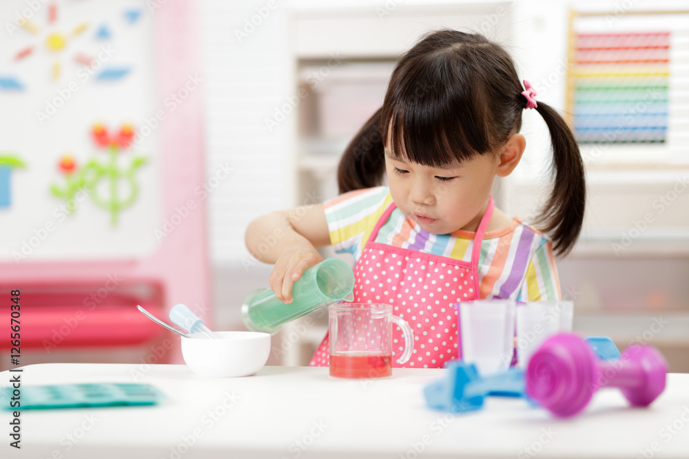 Young girl was doing science experiment at home Young girl was doing science experiment at home