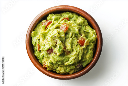 A bowl with guacamole is shown in isolation on white background, viewed from above