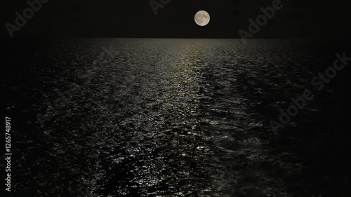 Full moon over the sea at night