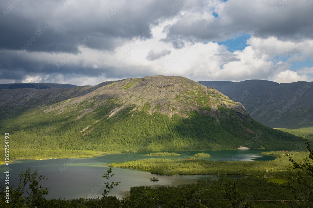 Naklejka premium Maly Woodyavr Lake in the Khibiny mountain range on a summer day with thunder clouds