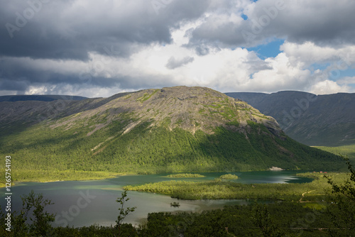 Maly Woodyavr Lake in the Khibiny mountain range on a summer day with thunder clouds