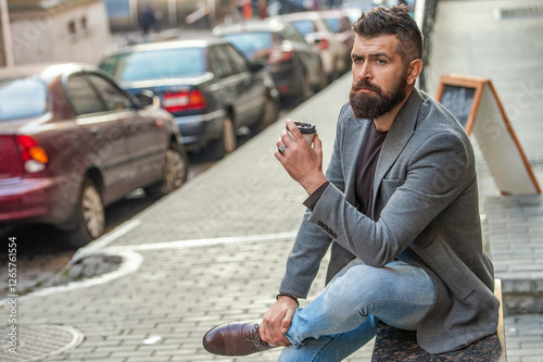 Wallpaper Mural Man drinking morning coffee. Coffee break. Everyday style routine. Bearded man having coffee in city street. Handsome man on street holding cup of coffee. Business lifestyle, break. Relax outdoor Torontodigital.ca