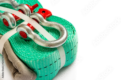 Car towing stop with metal shackles included. Car recovery kit with bow-shaped bracket and towing strap. Close-up on white background. Copy space photo