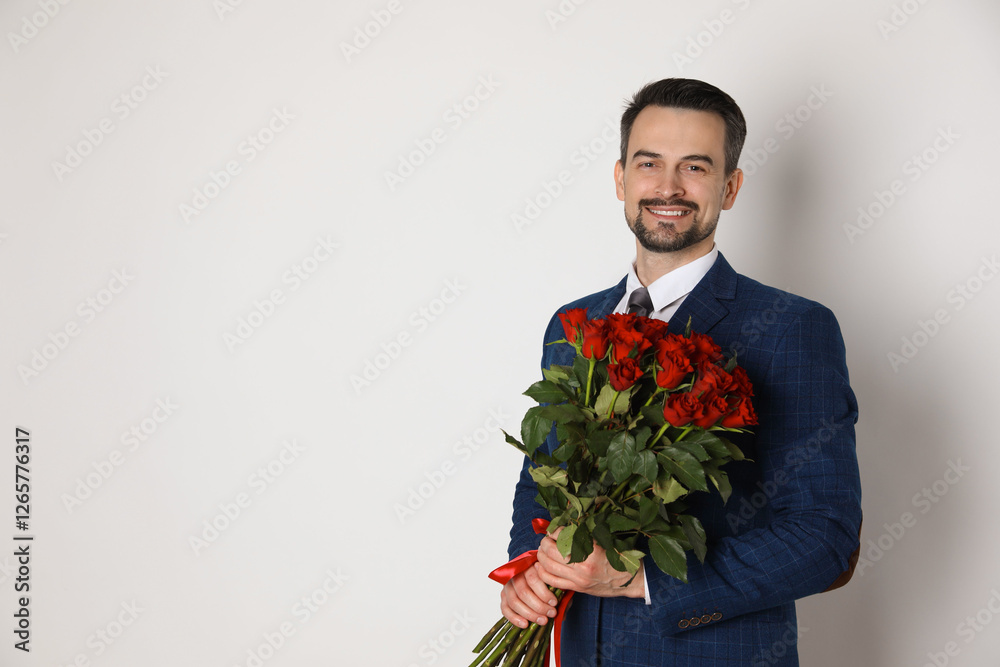 Happy Valentine's Day. Handsome man with bouquet of roses on white background. Space for text Happy Valentine's Day. Handsome man with bouquet of roses on white background. Space for text
