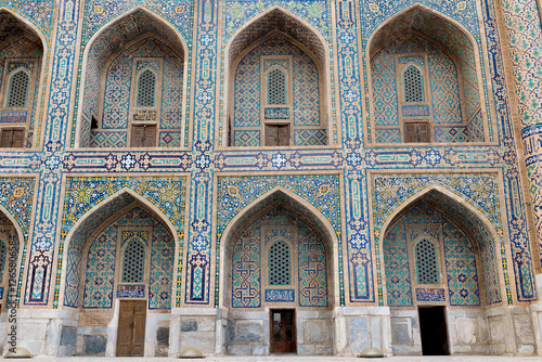 Antique oriental arch decorated with mosaics, ancient mosque in Samarkand, Uzbekistan. Historical landmarks.  photo