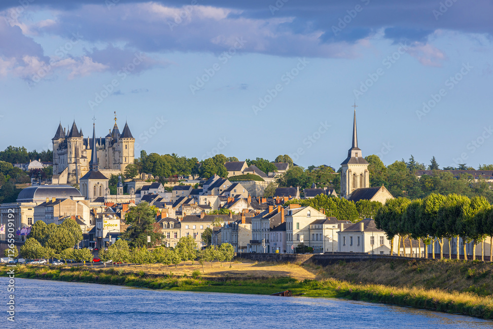 Fototapeta premium Saumur, France, located at the Loire river under a beautiful cloudscape during daytime.