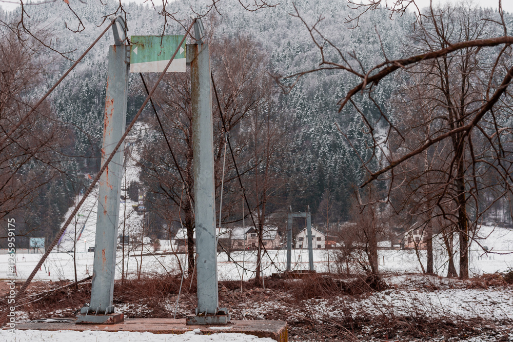 Demolished hanging or suspended bridge over savinja river at Ljubno, once a practical bridge now a dangerous relic
