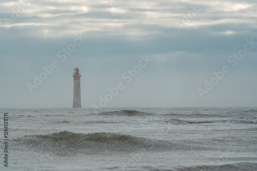 Chauveau lighthouse, isle of Re, during storm. this lighthouse is one of the famous lighthouses near La Rochelle, France