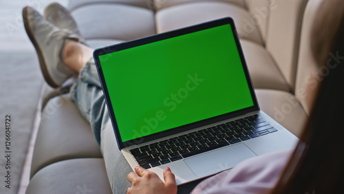 User touching chromakey laptop touchpad chilling at sofa closeup. Woman online