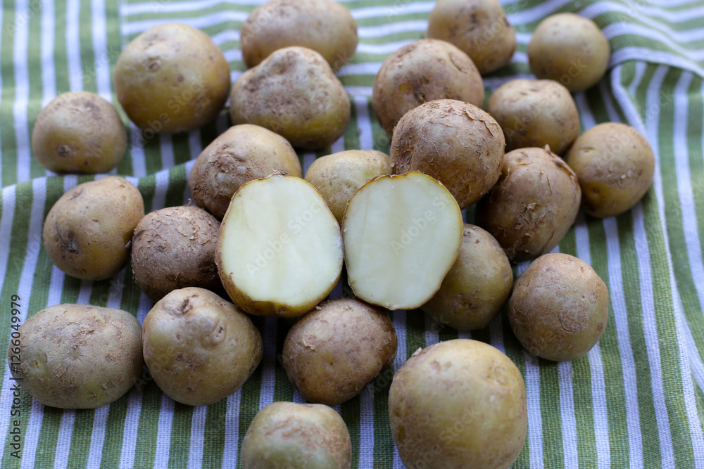 Raw fresh organic potatoes, Tiny potatoes Raw fresh organic potatoes, Tiny potatoes