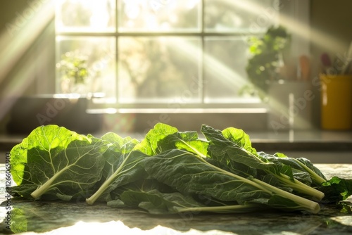 freshly harvested collard greens, splayed across a sunlit kitchen countertop