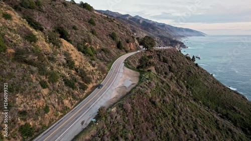 Epic Drone View of California’s Pacific Coast Highway Winding Along Steep Cliffs and Ocean