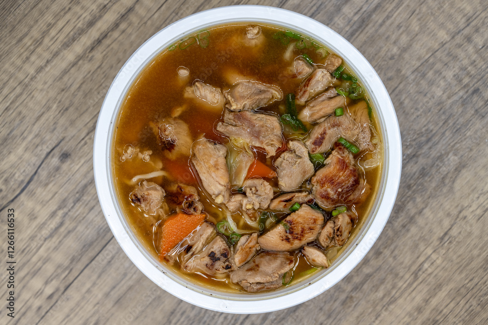 BBQ chicken noodle soup served hot and in a large bowl for a big appetite BBQ chicken noodle soup served hot and in a large bowl for a big appetite