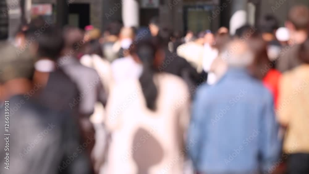 Blurry People in Tokyo City. Business District. Rush Hour Time People Are Walking on the Sidewalk. Japanese People Blurry People in Tokyo City. Business District. Rush Hour Time People Are Walking on the Sidewalk. Japanese People