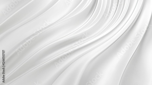 A close-up view of smooth white fabric with elegant folds, showcasing a soft texture and flowing design. The image captures light beautifully on the surface. photo