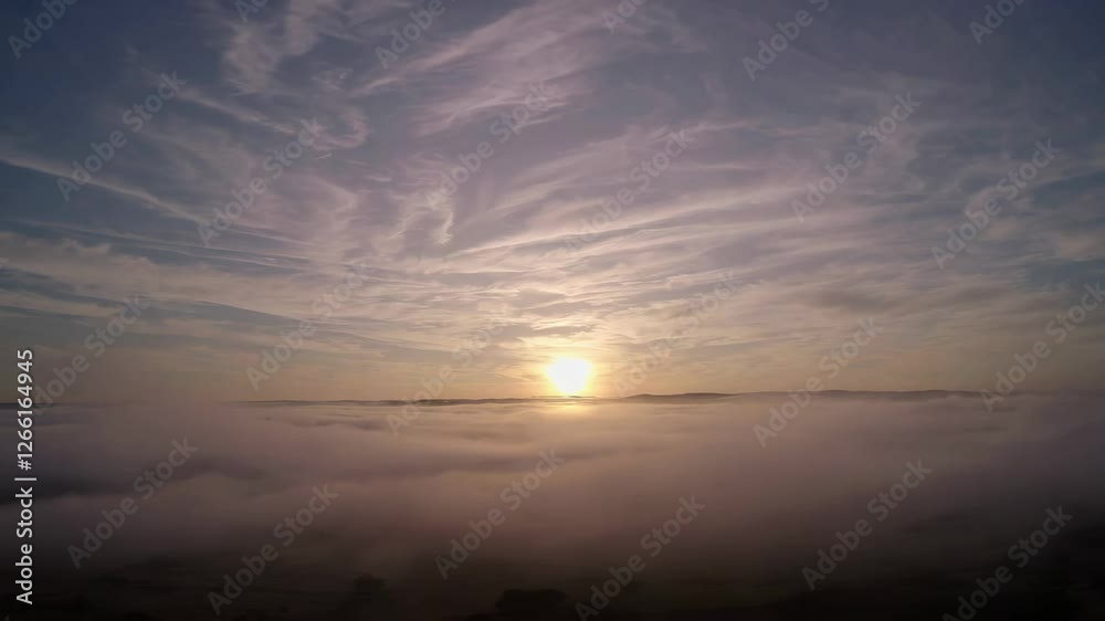 Sunrise over cloudy landscape with serene sky, tranquil morning view. Nature and serenity concept Sunrise over cloudy landscape with serene sky, tranquil morning view. Nature and serenity concept