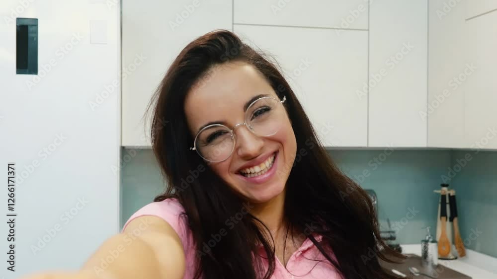 Young woman at home during quarantine. Girl with cheerful smile posing and waving with hand. Delightful beautiful woman attractive and sexy with glasses. Young woman at home during quarantine. Girl with cheerful smile posing and waving with hand. Delightful beautiful woman attractive and sexy with glasses.