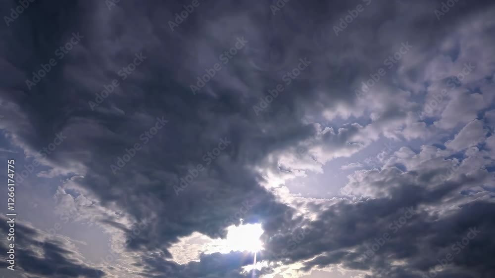 Dramatic cloudy sky with sun breaking through, atmospheric nature scene. Serenity and beauty in nature concept Dramatic cloudy sky with sun breaking through, atmospheric nature scene. Serenity and beauty in nature concept