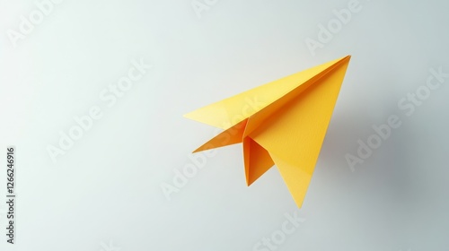Wallpaper Mural Bright yellow paper airplane in flight against a light gray background. Torontodigital.ca
