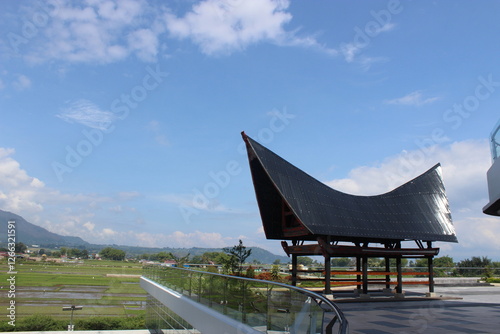 batak toba traditional house with gorga carving ornament photo