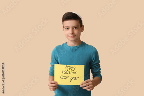 Little Muslim boy with gree...