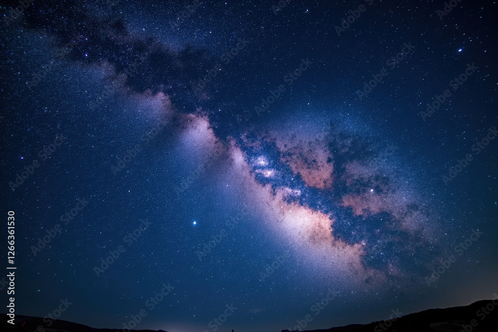 Fototapeta premium A Majestic View of the Milky Way Galaxy Over a Dark Sky: Capturing the Splendor of Stars, Nebulas, and Cosmic Wonders in a Remote Location of Earth