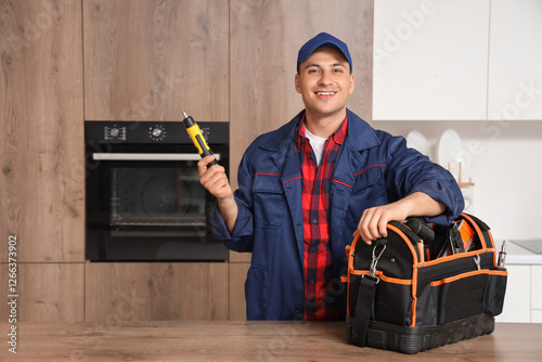 Male technician with bag of...