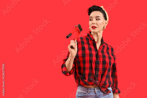 Young pin-up woman with pip...