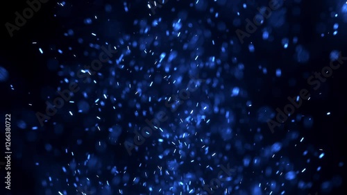 Blurred bokeh motion picture of animation Flying around blue fire dust particles sparks or ember from a burning fire with realistic movement. on a black background	