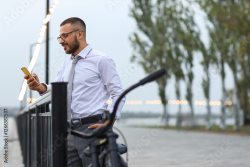 Young happy businessman wit...