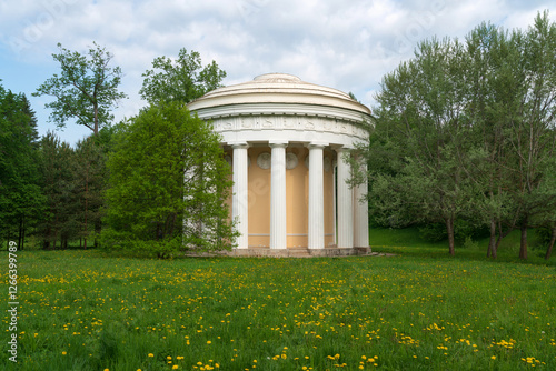 View of the Temple of Friendship on the bank of the Slavyanka River in the Pavlovsky Park on a sunny summer day, Pavlovsk, Saint Petersburg, Russia photo