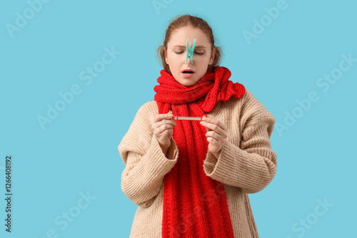 Ill young woman with clothe...
