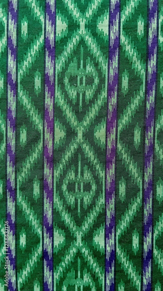 Obraz premium Traditional fabric pattern. traditional Indonesian woven fabric. Sarong. Green pattern