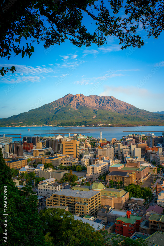 Fototapeta premium Sakurajima, an active stratovolcano, viewed from Shiroyama observation deck with Kagoshima city in Kyushu, Japan