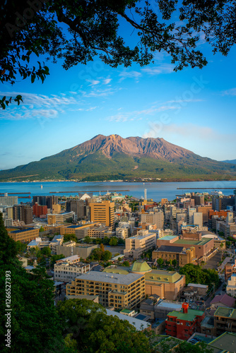 Sakurajima, an active stratovolcano, viewed from Shiroyama observation deck with Kagoshima city in Kyushu, Japan photo